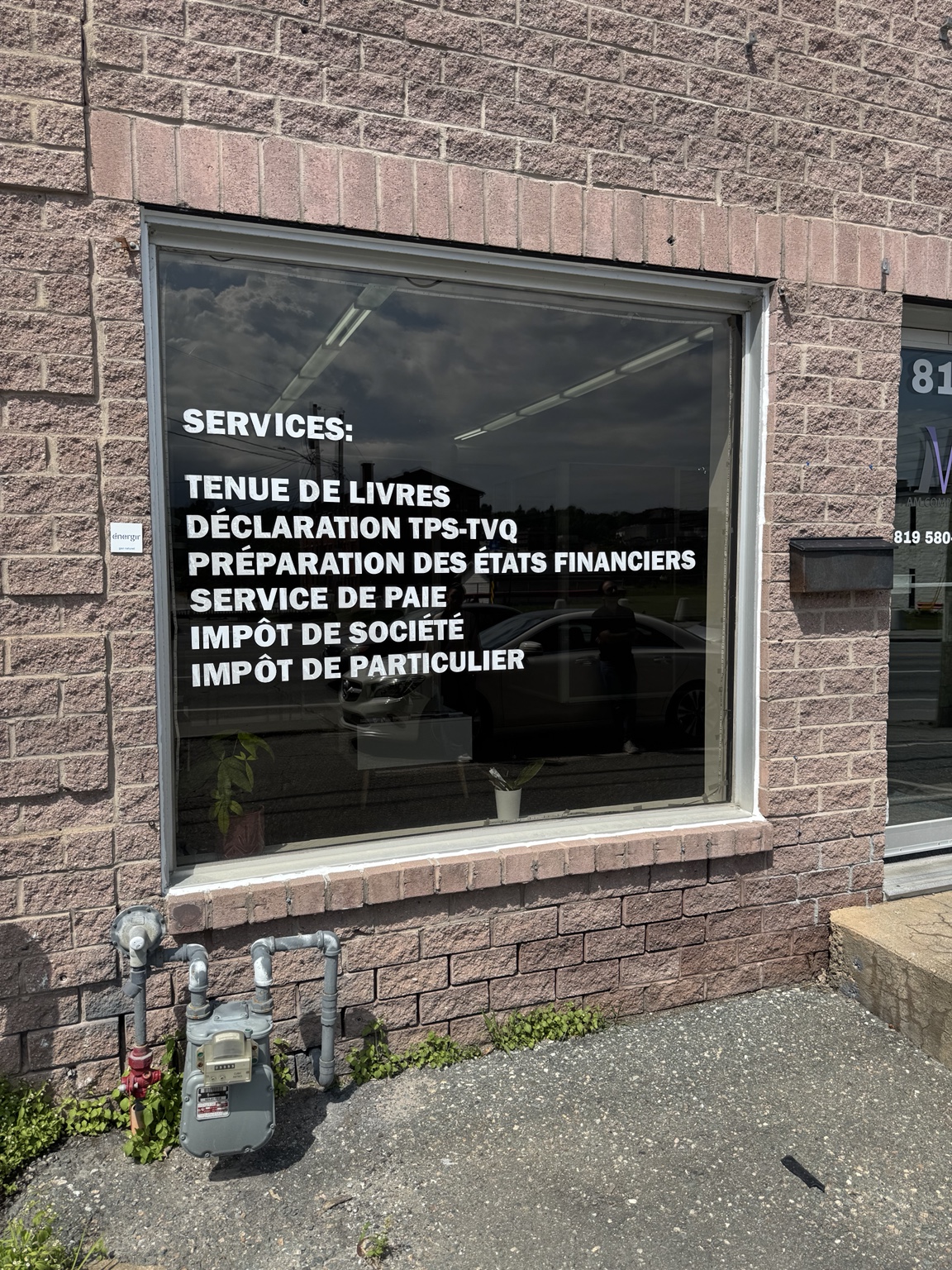 Original AM Comptable storefront before transformation